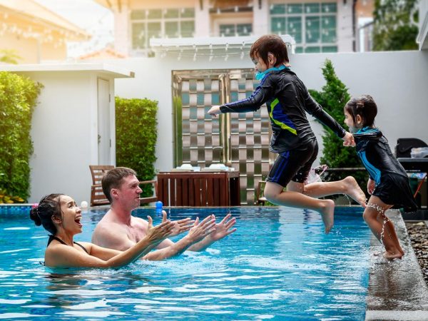 family-swimming-in-a-pool-EXPORT-600x450